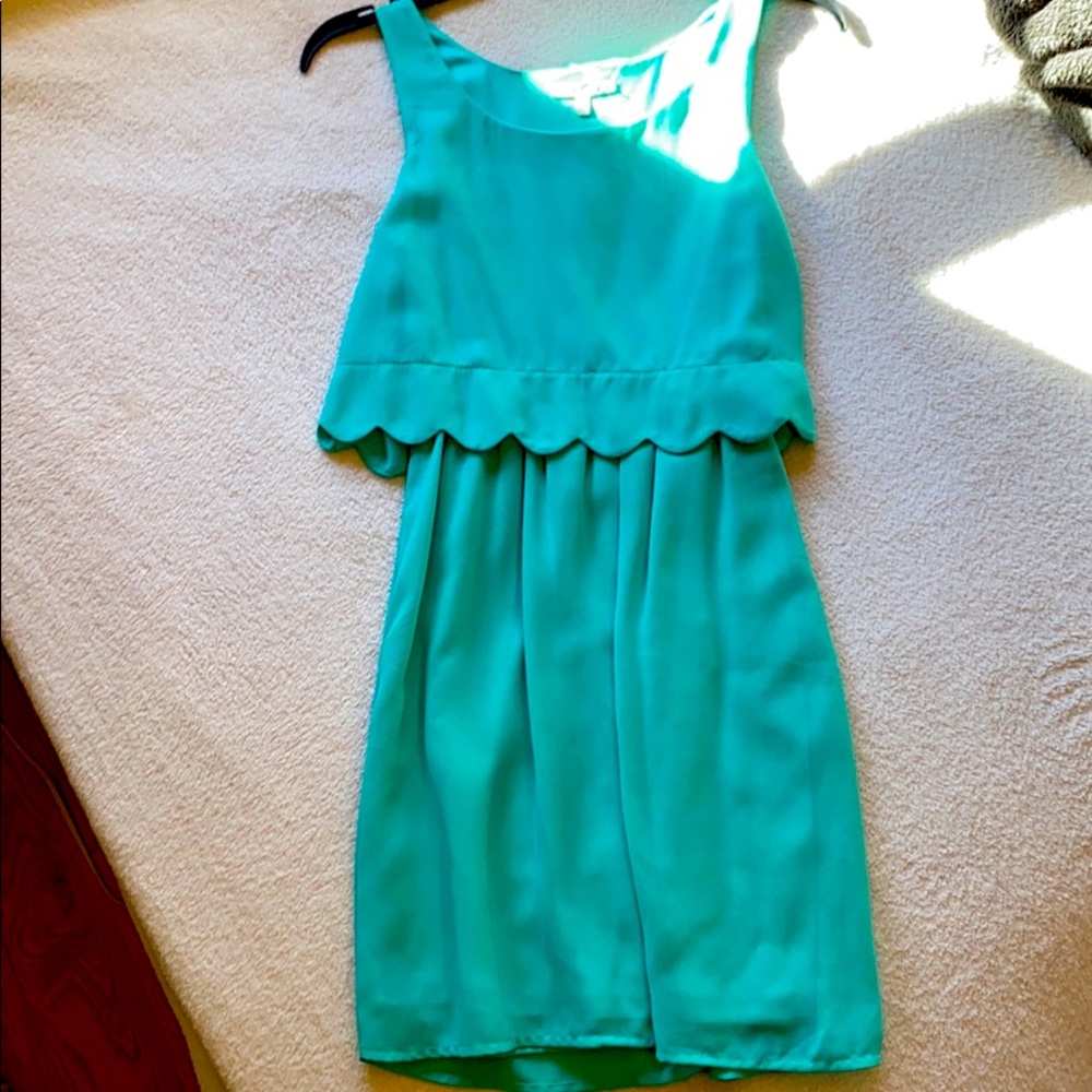 A teal, flowy, dress comfortable for any event!